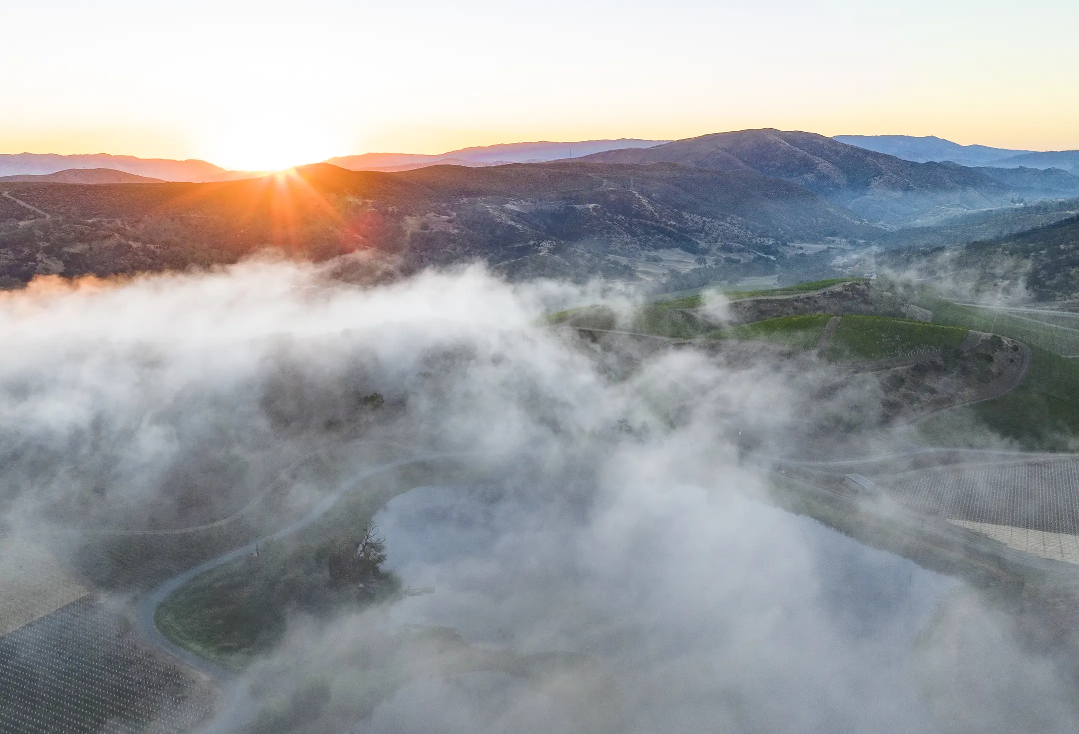 Above the clouds drone image of Somerston Estate.