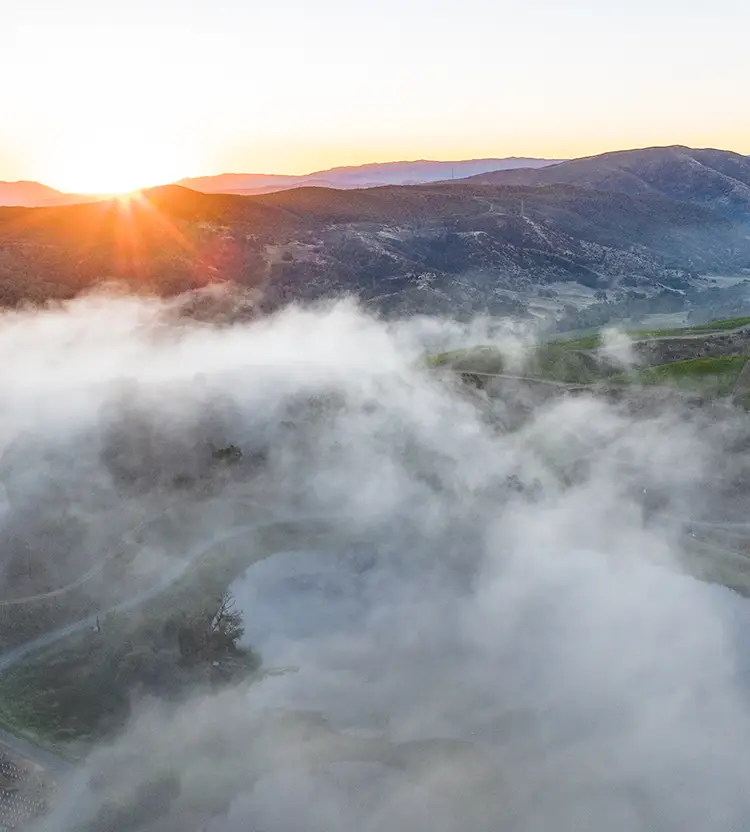 Above the clouds drone image of Somerston Estate. (mobile banner)