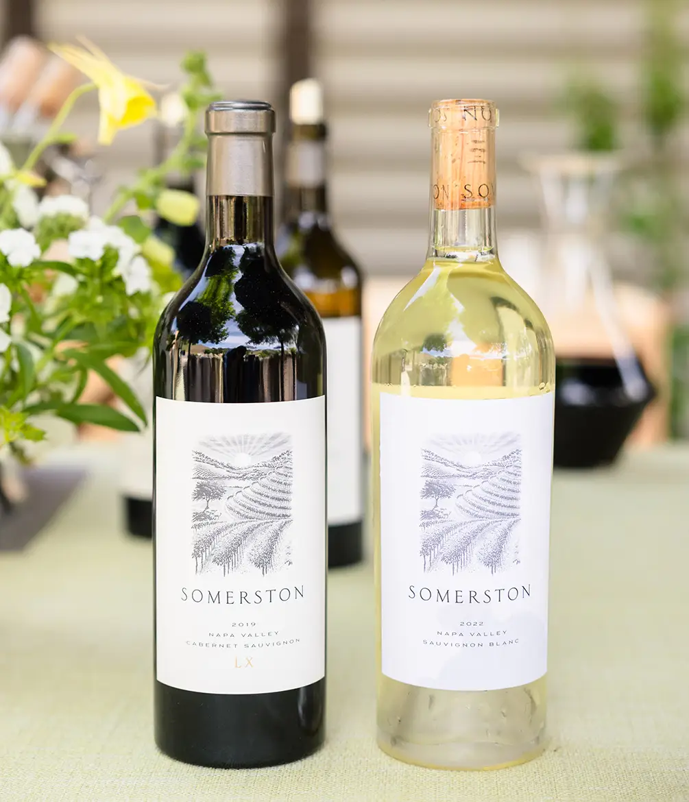 Two Bottles of Somerston wine on a dining table.
